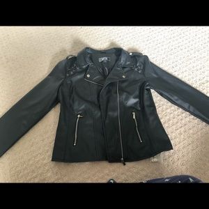 Leather jacket in black with a tag